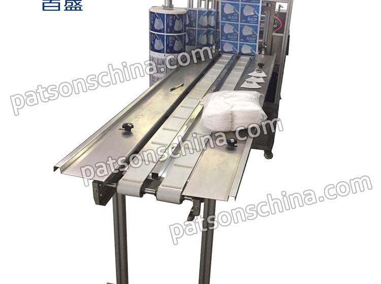 Four-side sealing face mask packaging machine